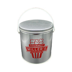 shiny grey popcorn tin with red miller's logo.
the logo is a stylized movie popcorn bag with Miller's Gourmet Popcorn in the foreground