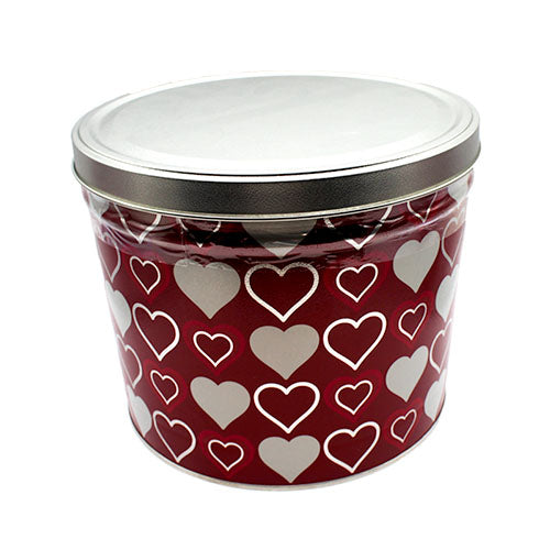 red popcorn tin covered with 3 heart pattern. 1. solid white heart 2. white heart outline 3. pink heart outline inside white heart outline
tin has shiny grey lid