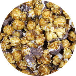 yellow glazed popcorn with a chocolate drizzle