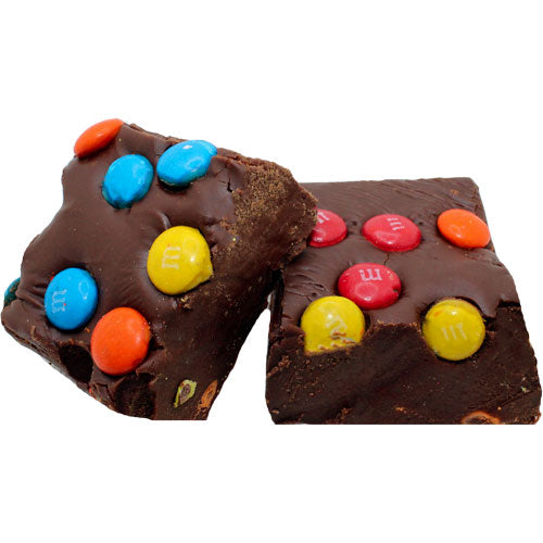 dark brown fudge with blue, yellow, red, and orange m and m's 