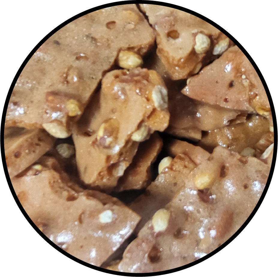 light brown peanut brittle with peanuts throughout 