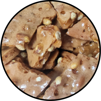 light brown peanut brittle with peanuts throughout 